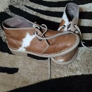 Shoes with cow hide on them